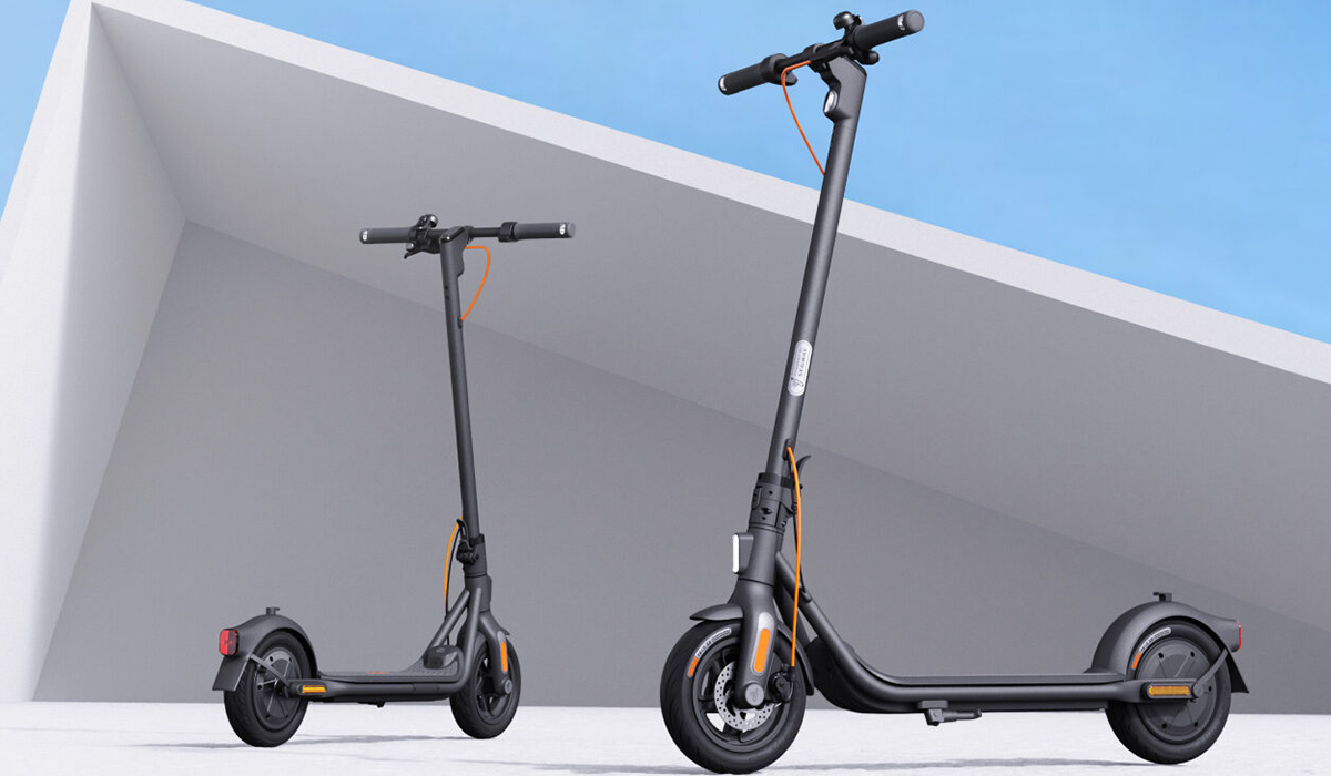 Two sleek electric scooters are positioned against a minimalist background, showcasing their modern design and features.